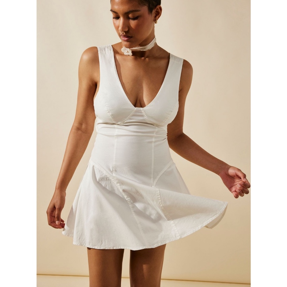 Free People eye catching mini dress white size medium- new with tags